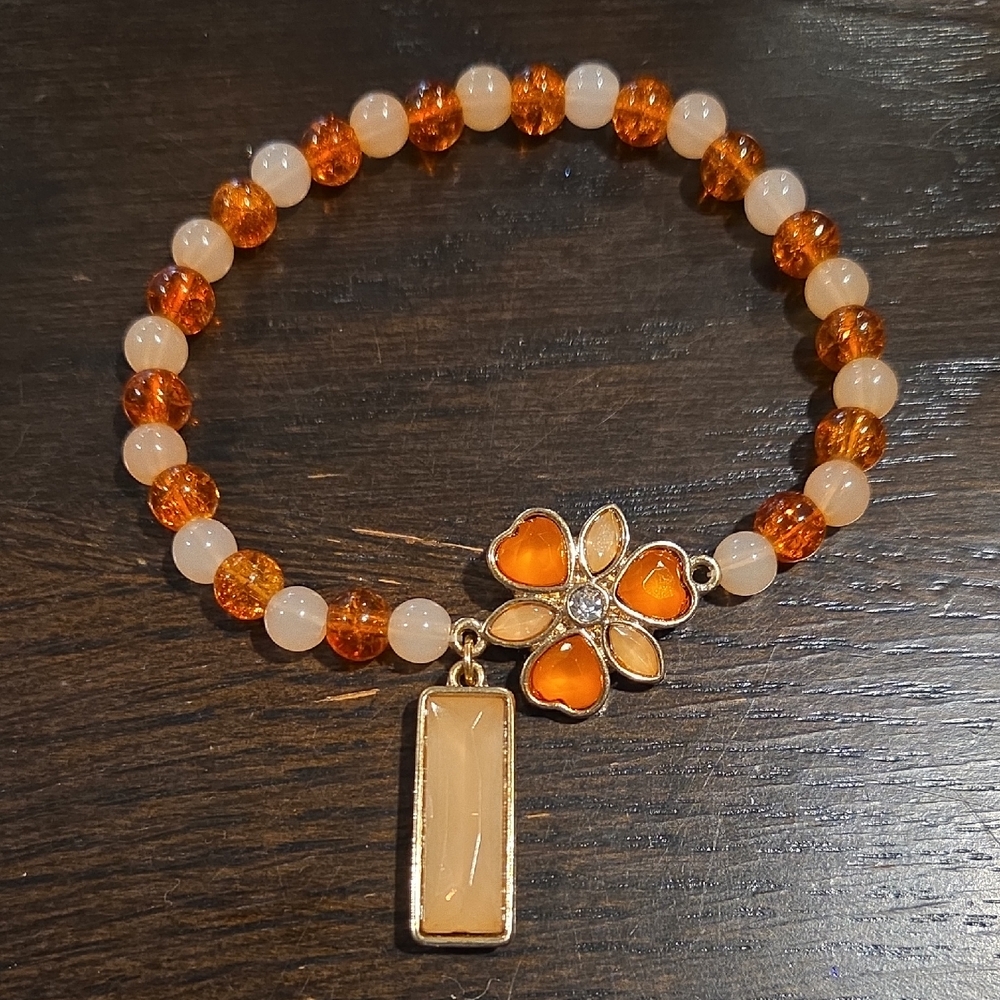 Handmade Orange and Cream Beaded Bracelet with Floral Charm